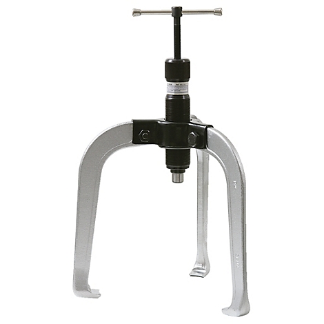 Dreifuß-Abzieher. Silberfarbene Greifarme, schwarzer, zylindrischer Mittelteil mit Handgriff.